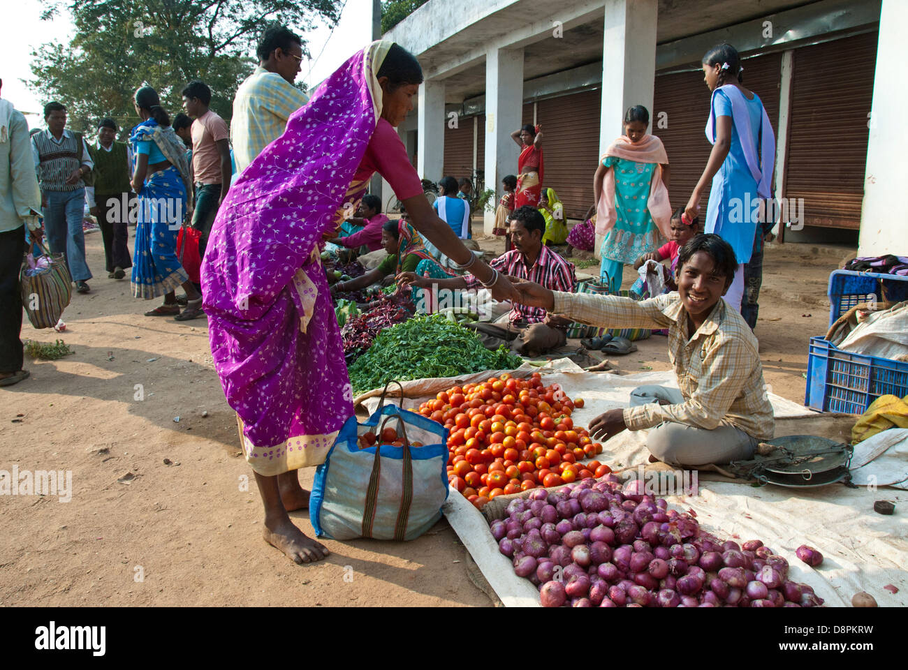 Indian vendor and customer at outside market in Mocha Village in Madhya Pradesh, India Stock Photo