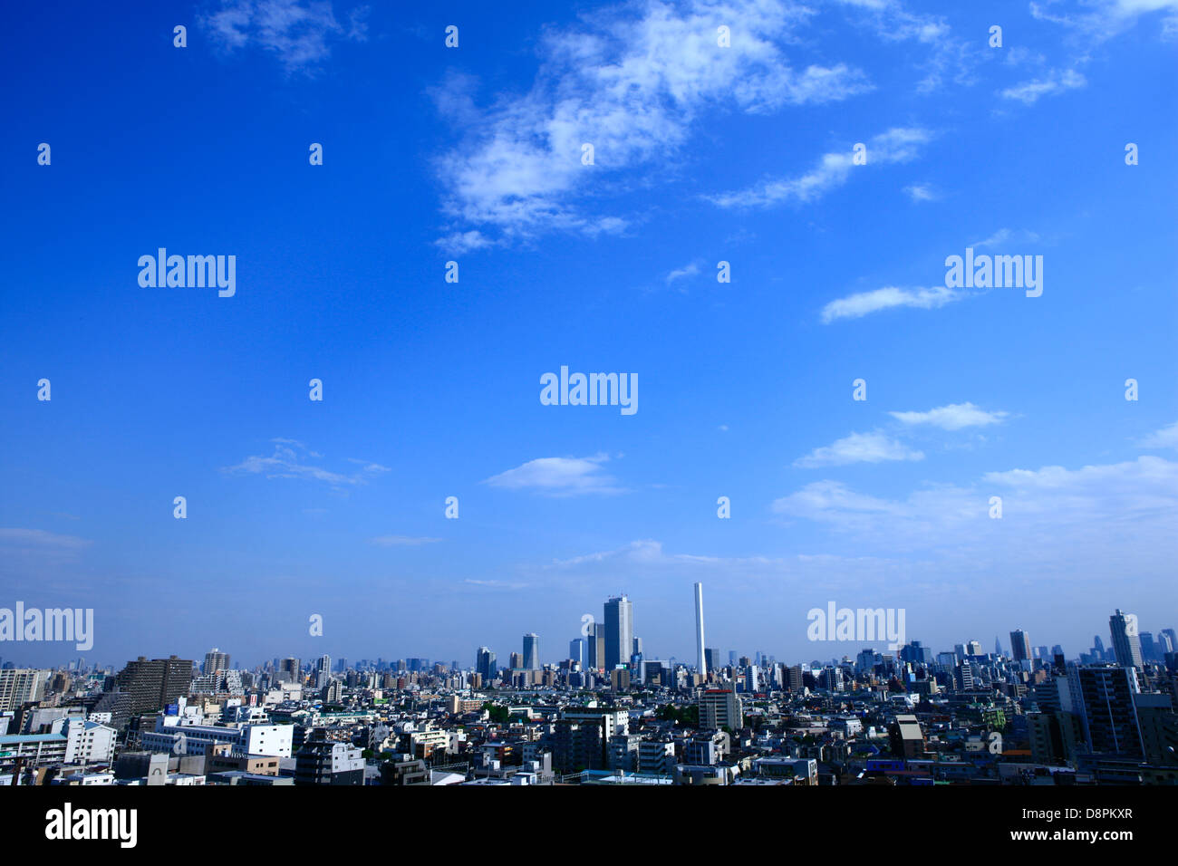Blue sky with clouds and cityscape Stock Photo - Alamy