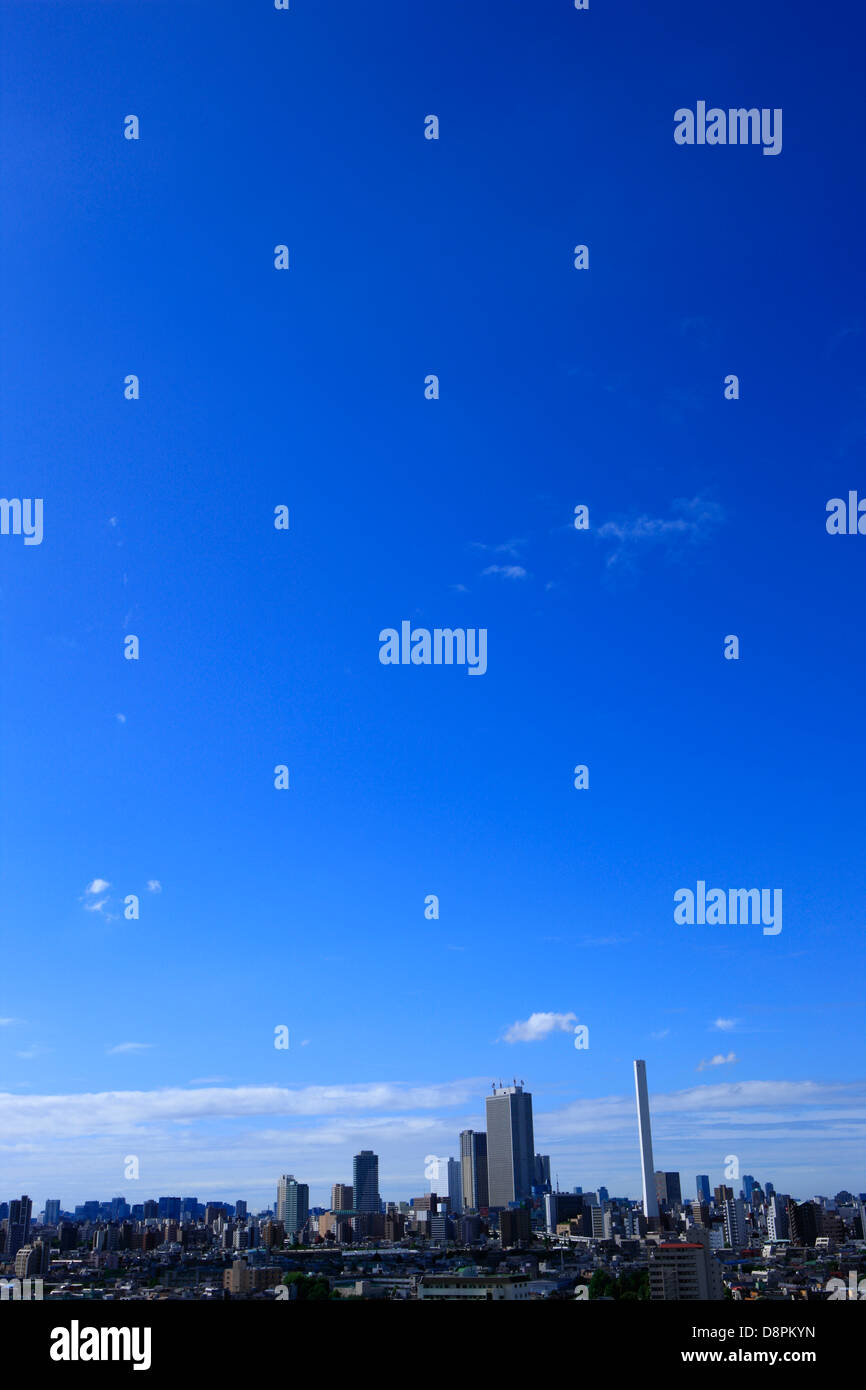 Blue sky with clouds and cityscape Stock Photo - Alamy