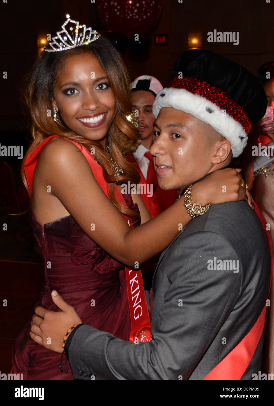 A king and queen at the high school prom dance together Stock Photo