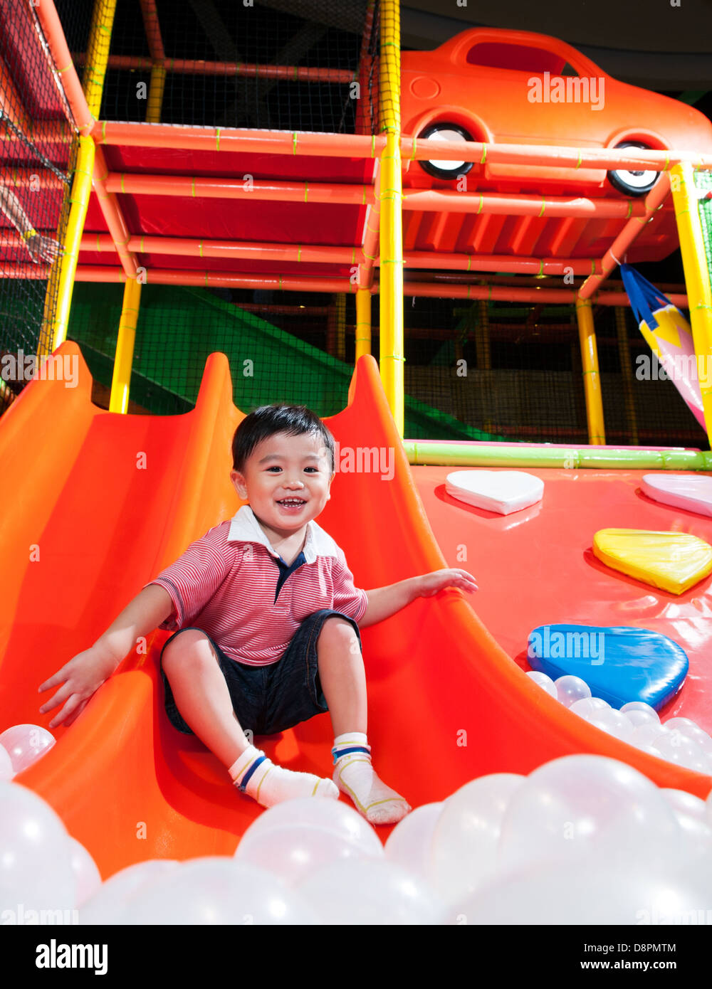 Young Boy In Indoor Playground Stock Photo
