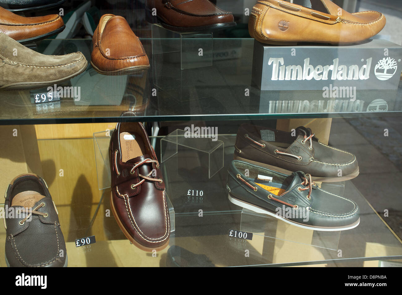 Timberland shoes on display in shop window Stock Photo - Alamy
