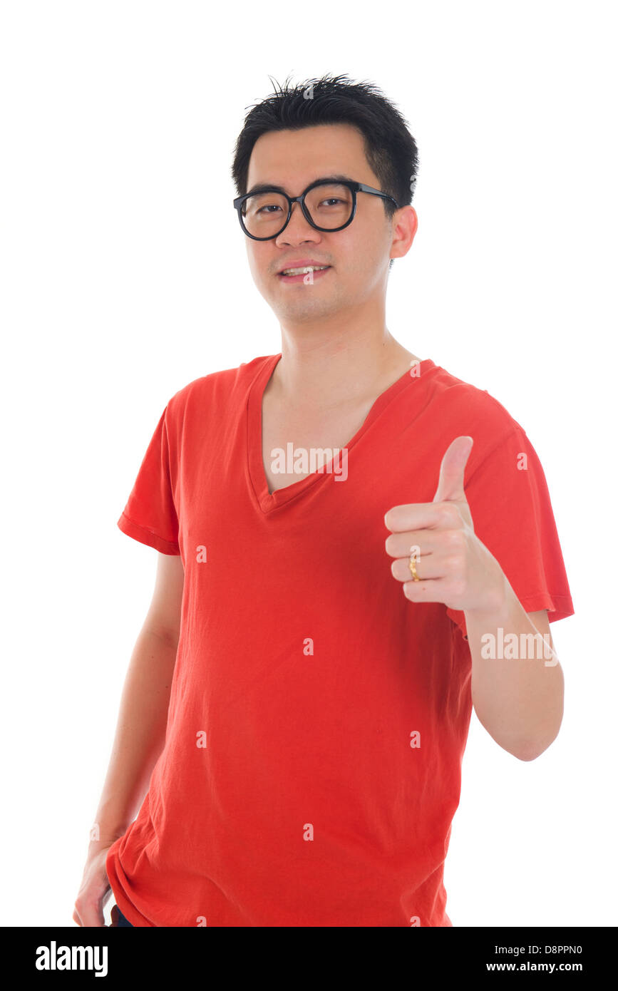 young asian man with a big smile and thumbs up sign Stock Photo - Alamy