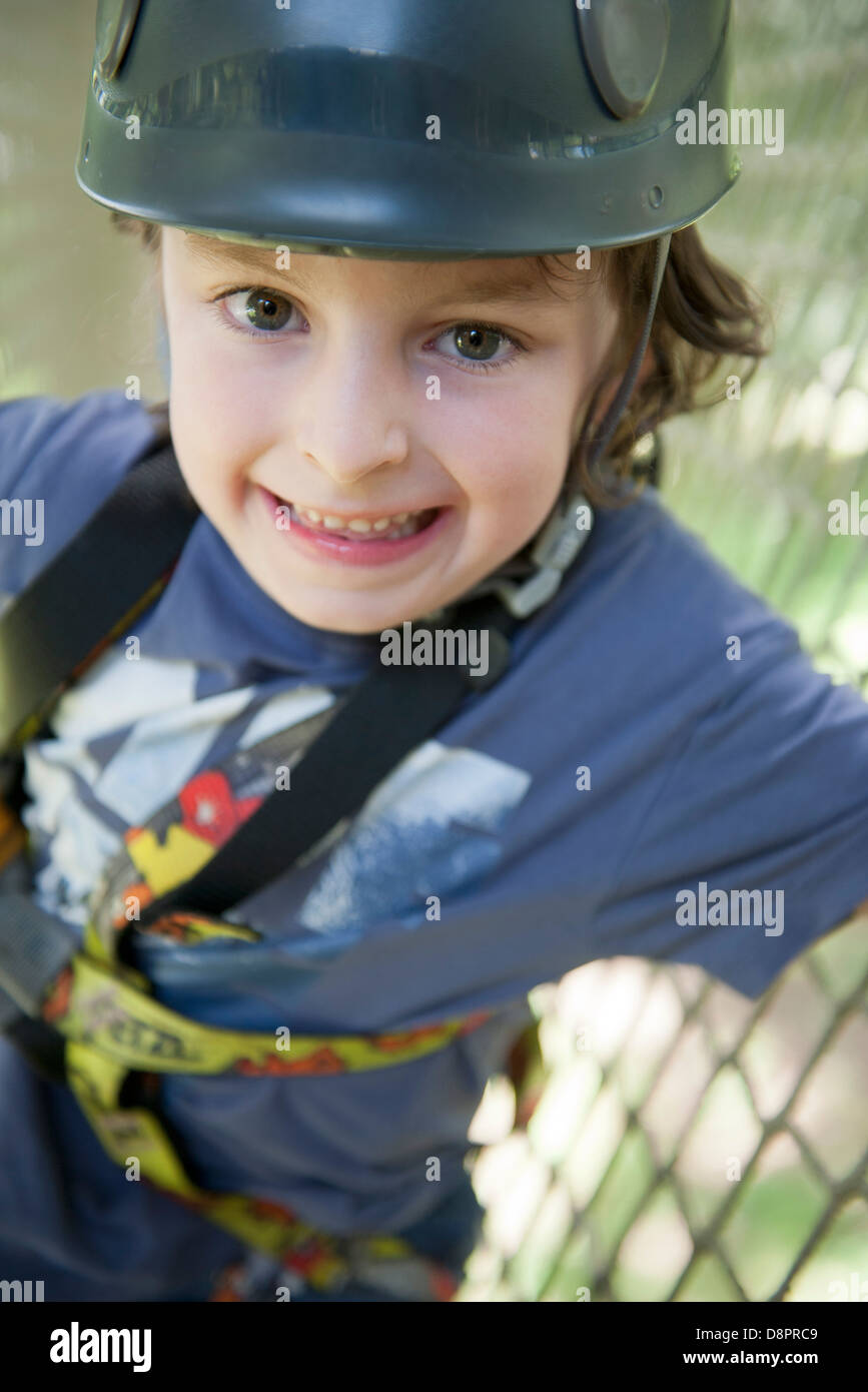 Boy wearing helmet, smiling Stock Photo Alamy