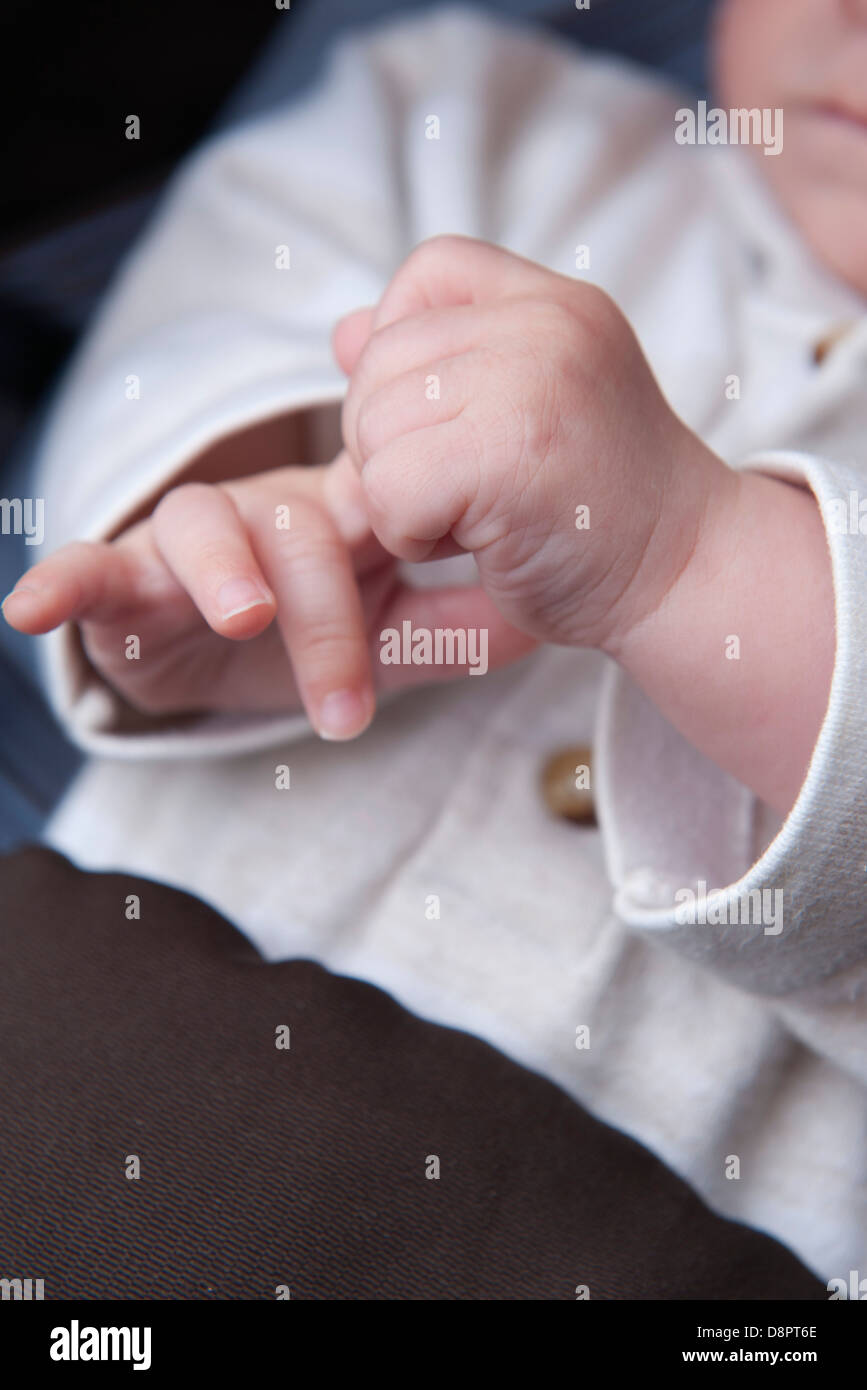 Baby pulling fingers, cropped Stock Photo Alamy