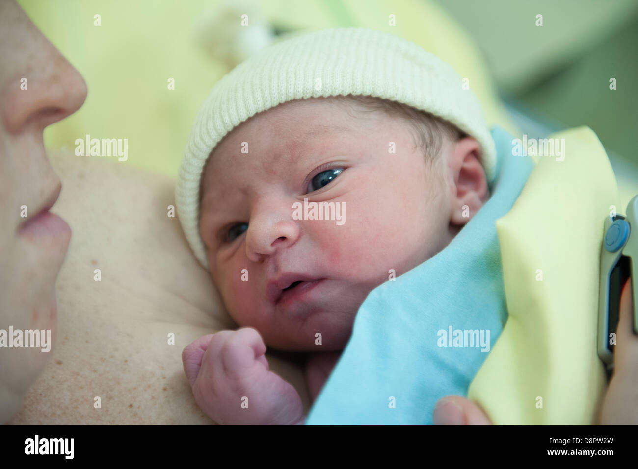 Newborn baby lying on mother's chest Stock Photo Alamy