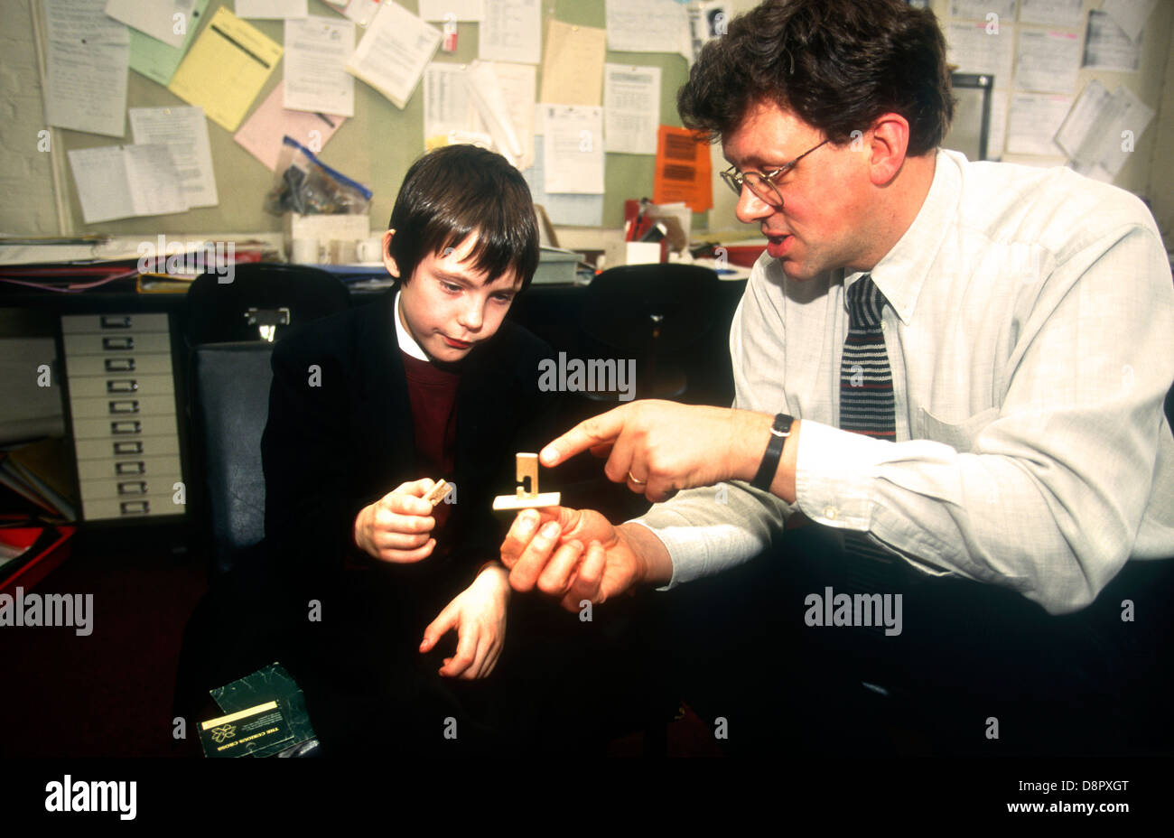 Educational psychologist using abstract testing with pupil with reading problems, Southwark