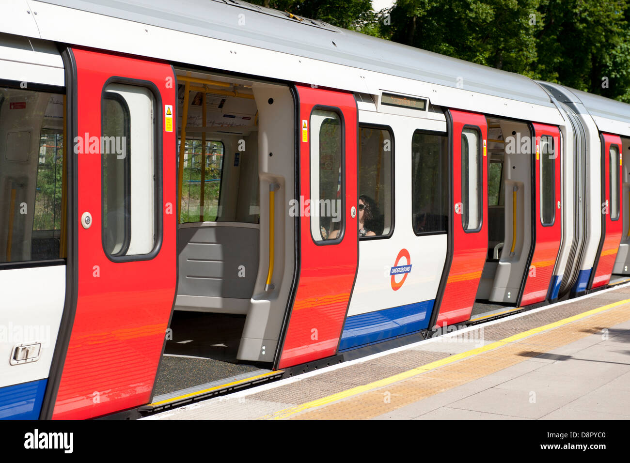 London Underground train formed of eight car S8 stock at Chorleywood Railway Station, Hertfordshire, UK