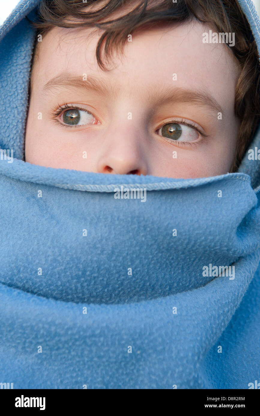 Boy wrapped up in blanket Stock Photo Alamy