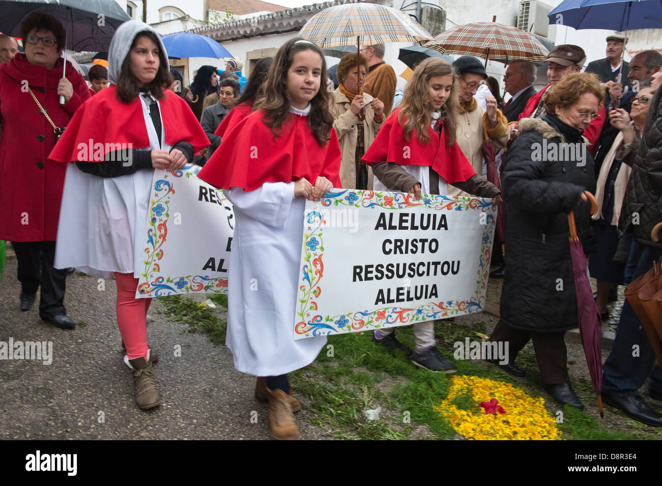Children carry banners 'Aleluia Cristo Ressuscitou Aleluia' Easter Sunday Flower Torches Festival São Brás de Alportel Portugal Stock Photo