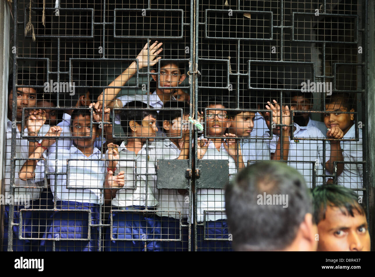 Pupils behind bars, College Street, Kolkata, India Stock Photo