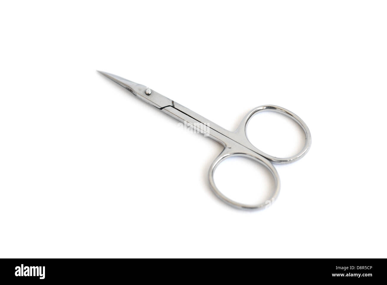 A small metallic scissors isolated on white Stock Photo - Alamy