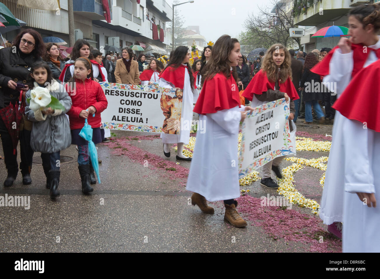 Children carry banners 'Ressuscitou Como Disse Aleluia!' Easter Sunday Flower Torches Festival São Brás de Alportel Portugal Stock Photo