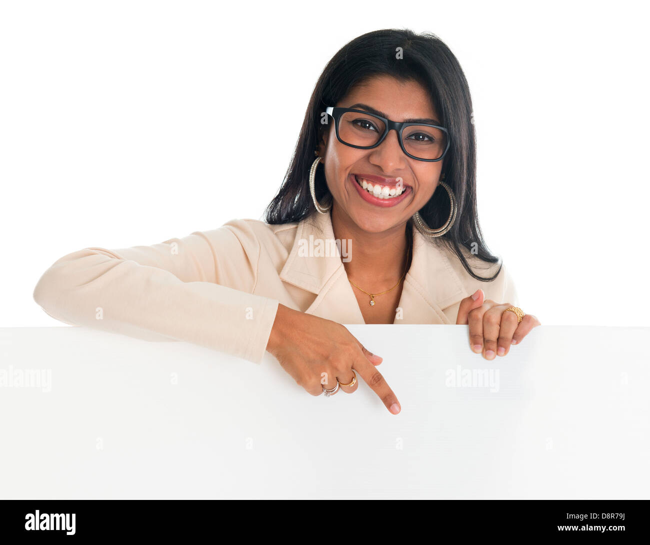 Indian woman holding and pointing to blank billboard portrait of