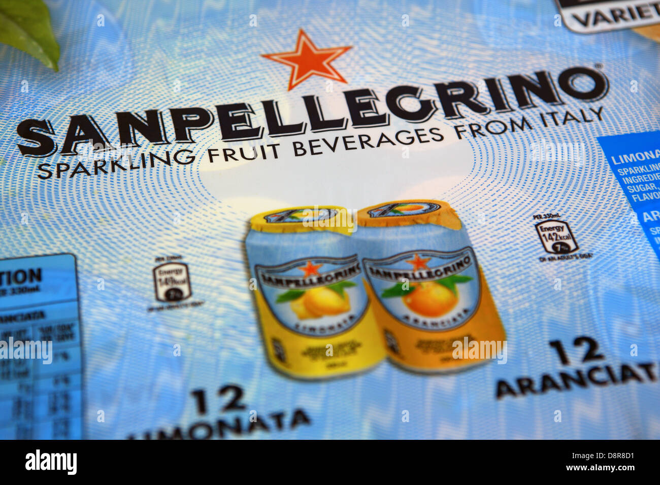 Pack of orange and lemon cans of San Pellegrino sparkling drinks form Italy Stock Photo
