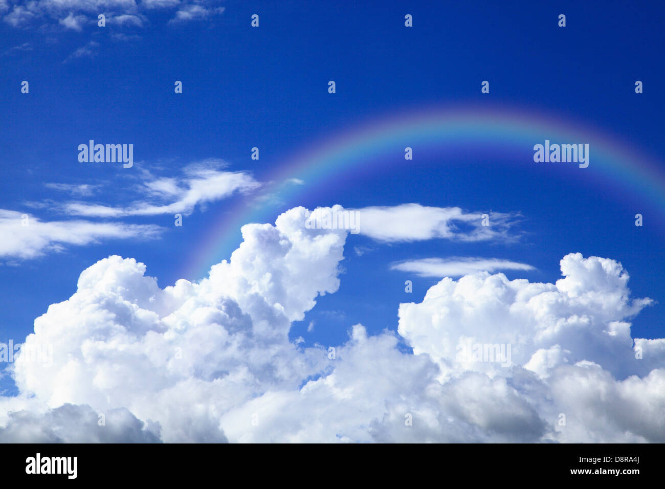 Blue sky with clouds and rainbow Stock Photo - Alamy