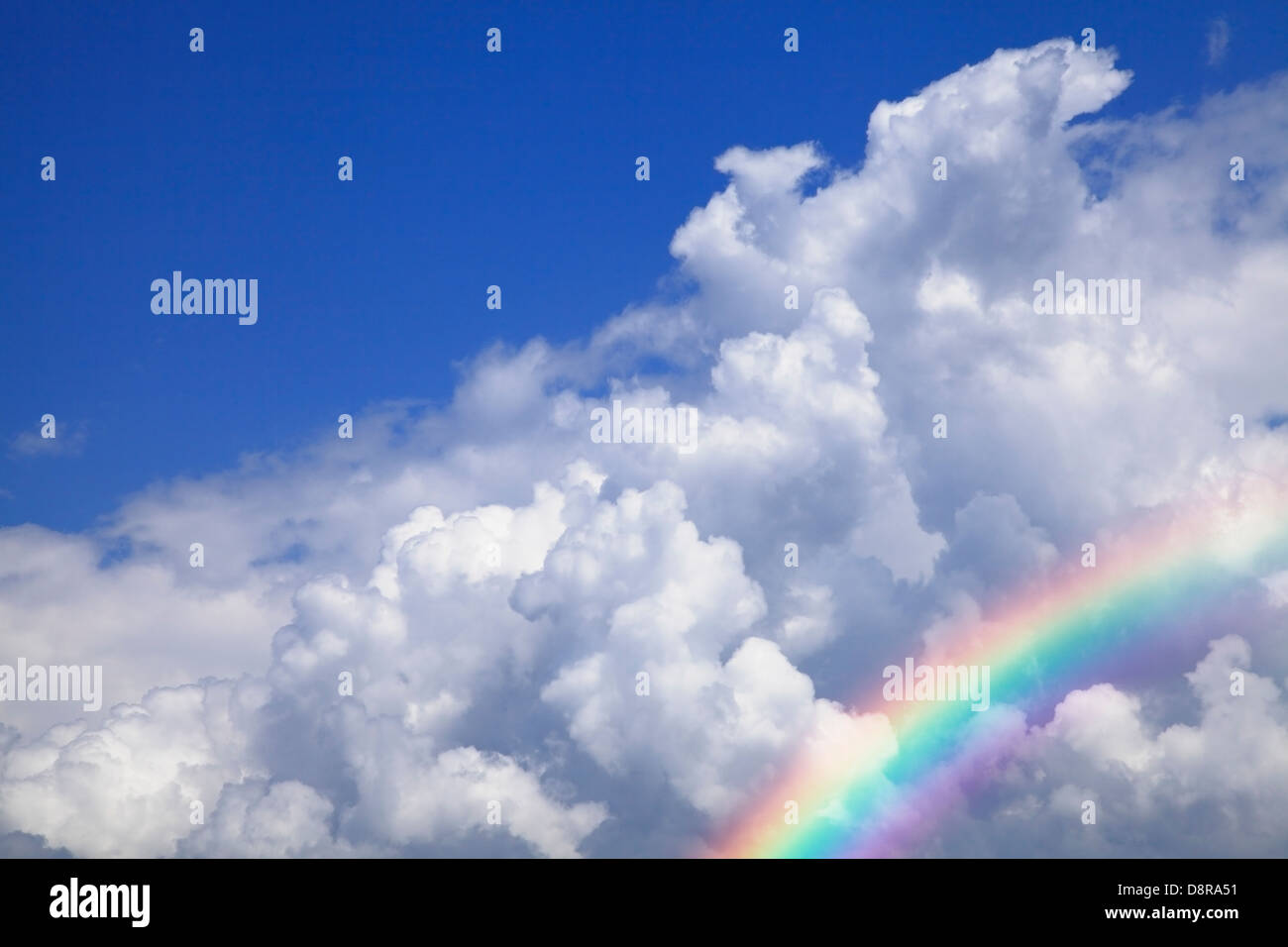 Blue sky with clouds and rainbow Stock Photo - Alamy