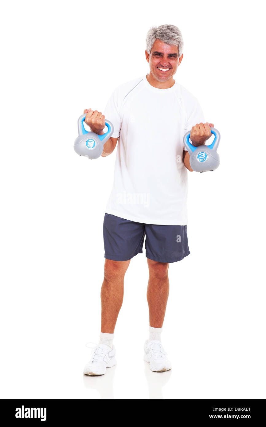 happy middle aged man exercising with kettle bells on white background ...