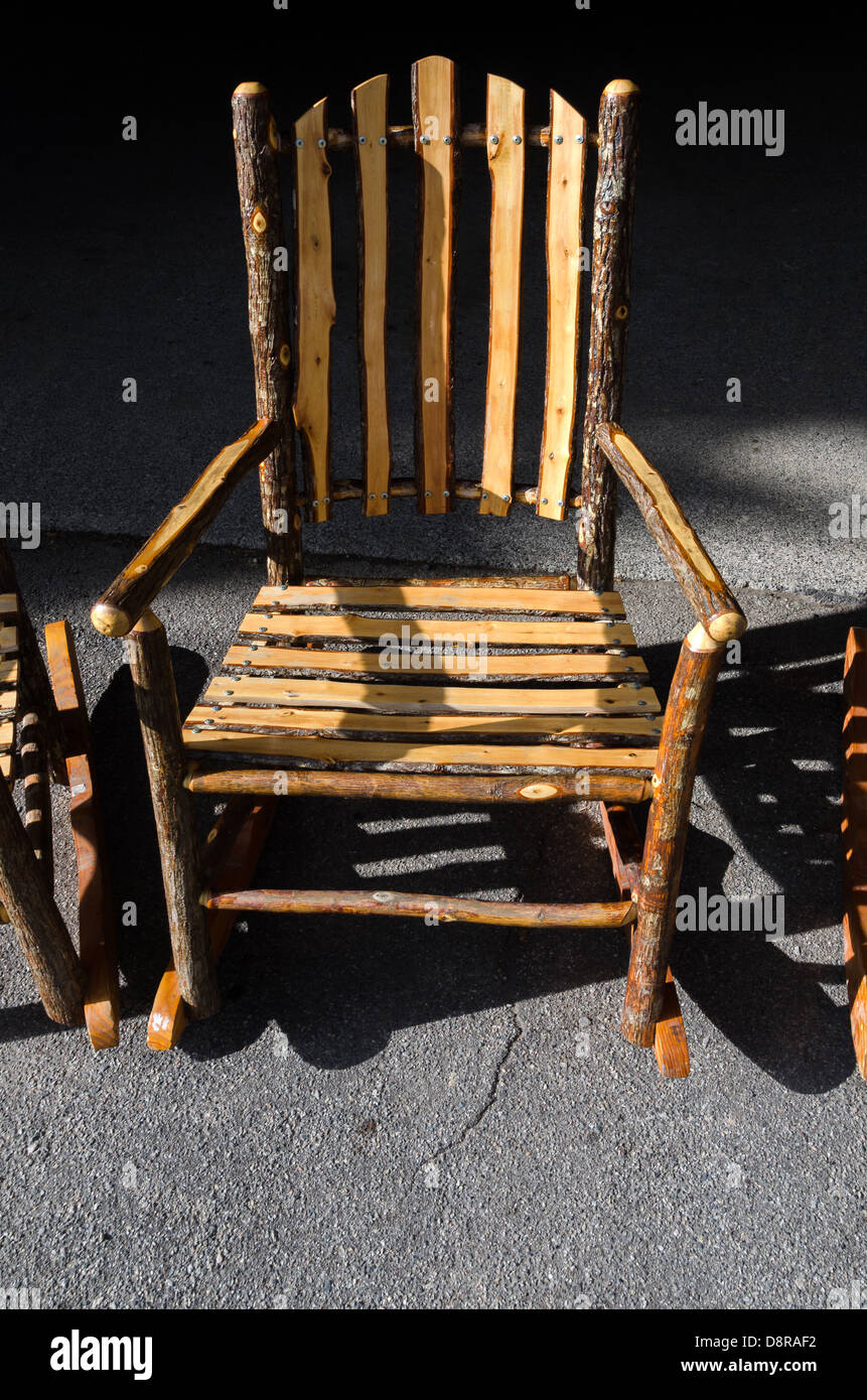 rocking chair with wooden logs in Yellowstone Stock Photo