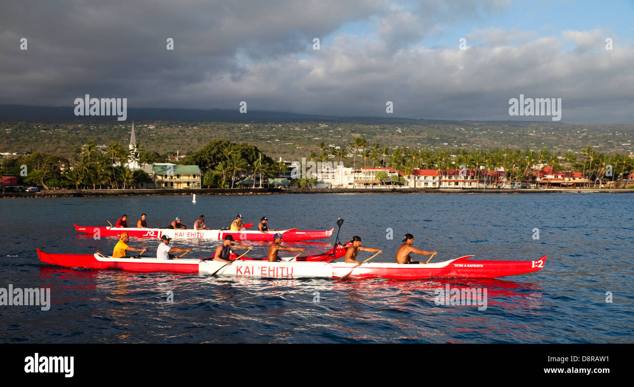 Outrigger canoes in Kailua Bay on the Big Island of Hawaii Stock Photo