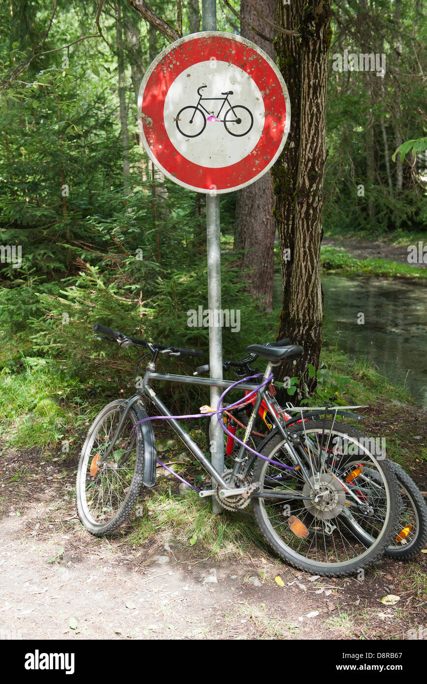 Bicycles locked to bicycle path sign Stock Photo