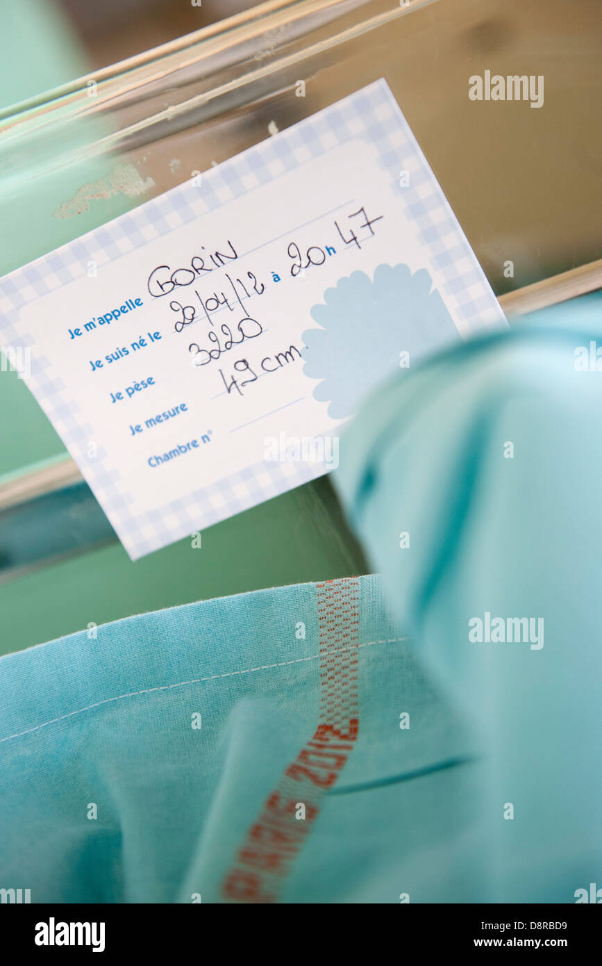 Name tag on hospital baby crib Stock Photo