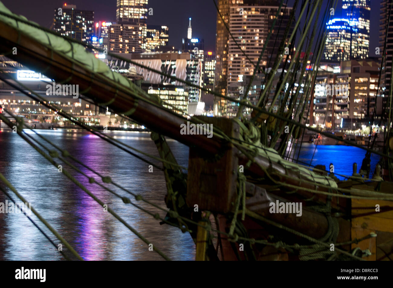Melbourne city sky line at night with light reflection on water old rigged sail ship mask and sale at the foreground Stock Photo