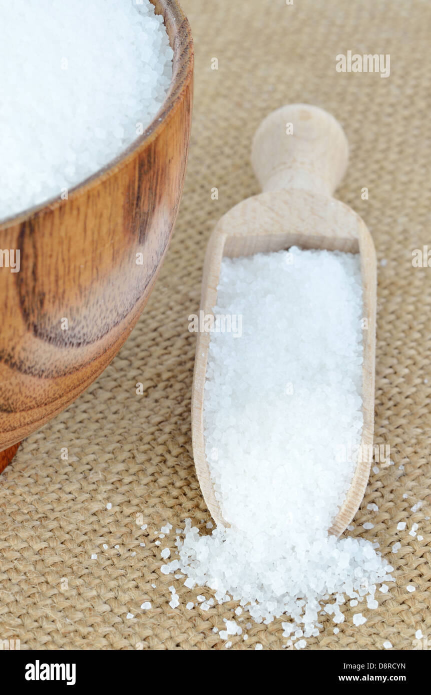 wooden bowl of sugar with wooden spoon Stock Photo