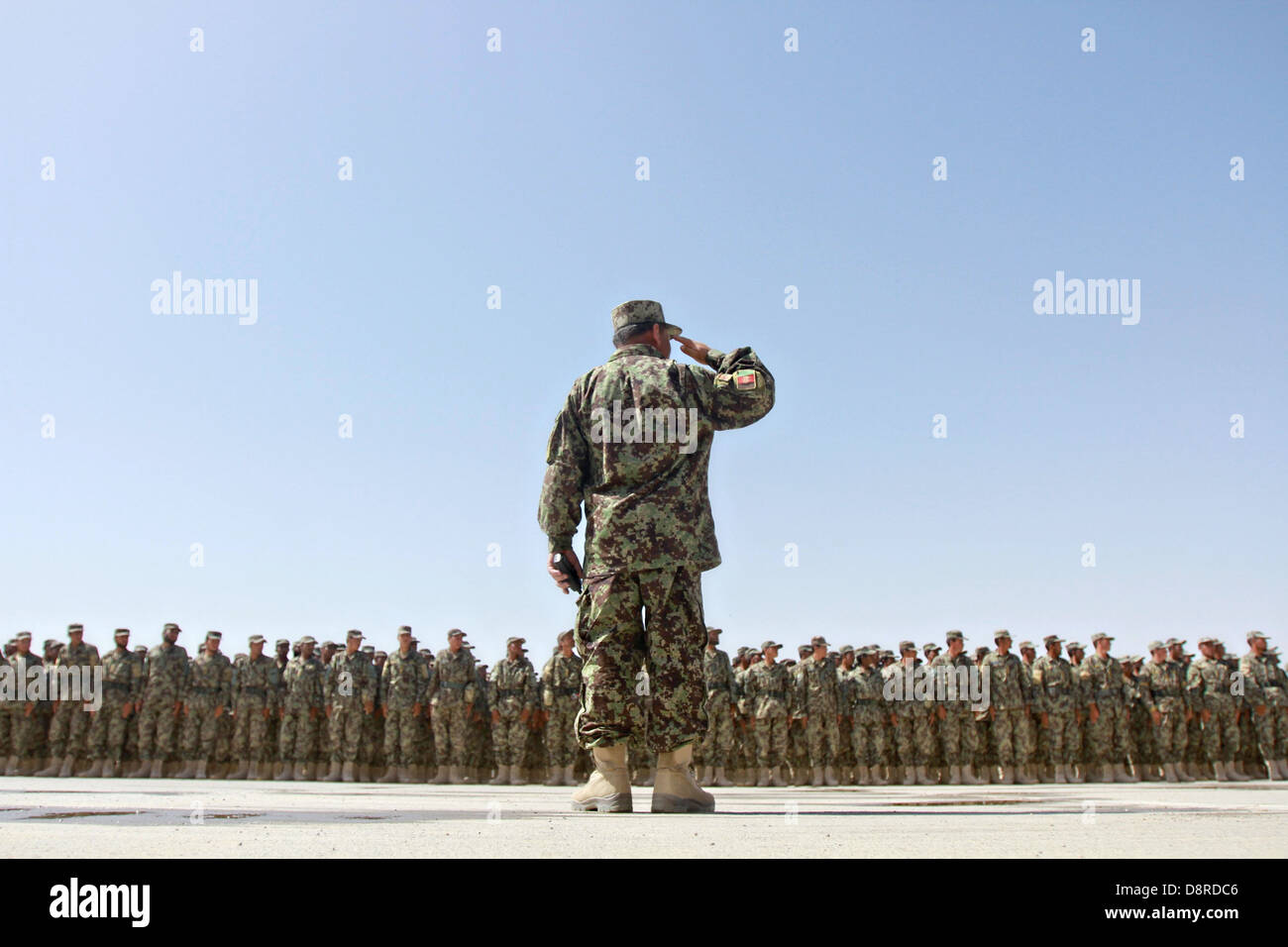 Afghan National Army soldiers stand in formation during the graduation of the 215th Corps Regional Military Training Center's Reception, Staging, Onward Movement and Integration training May 23, 2013 at Camp Shorabak, Helmand Province, Afghanistan. More than 500 soldiers graduated from the program and will be deployed replacing departing US soldiers. Stock Photo