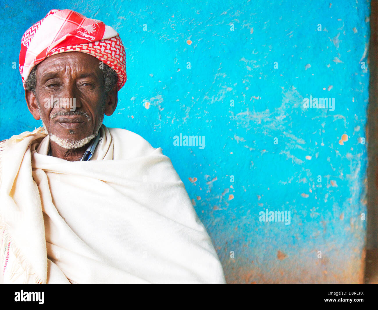 Elderly Ethiopian man sat in a roadside cafe near the Ethiopian Kenyan Border Stock Photo