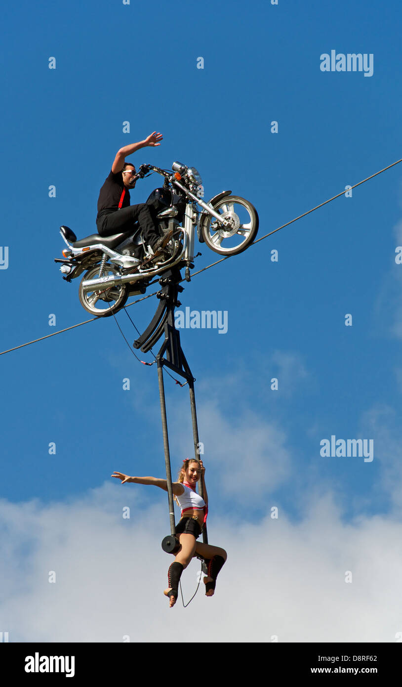 Motorbike stunt rider with girl Albert Park Melbourne Victoria Australia Stock Photo