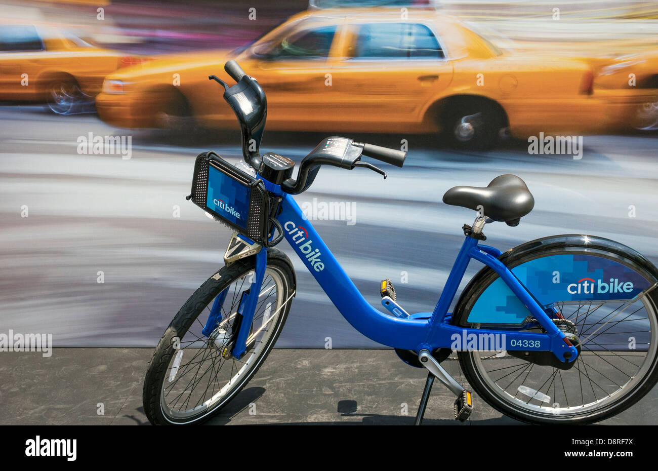 A NYC Citi Bike is contrasted against yellow taxis as local transportation Stock Photo