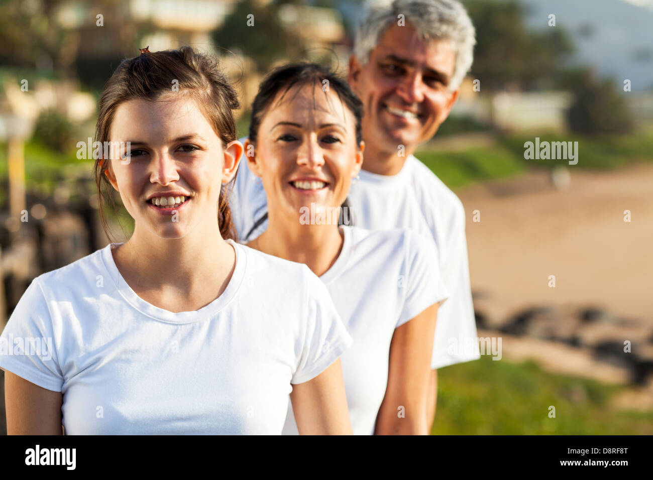 healthy family portrait at the beach in the morning Stock Photo