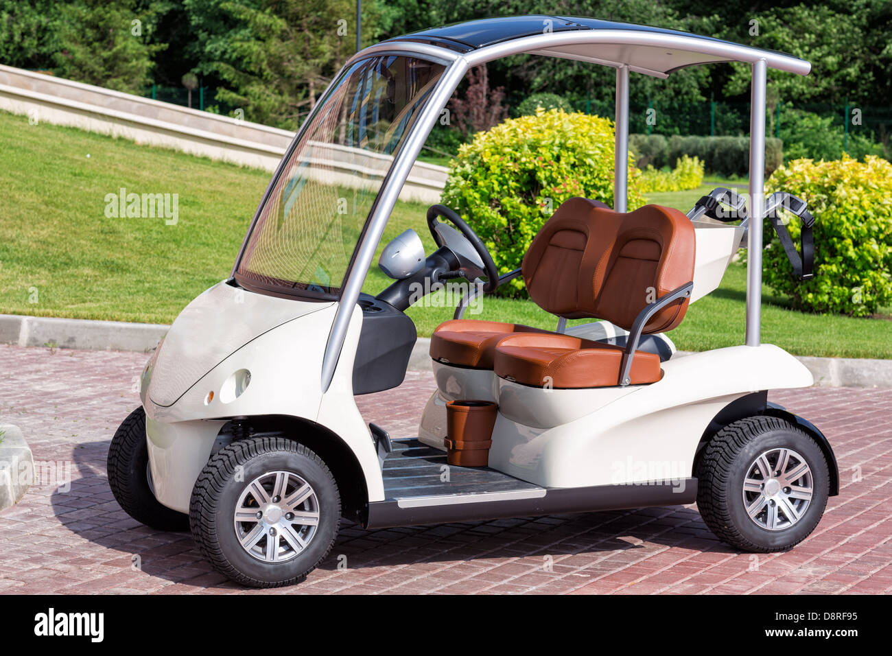 Electric golf cart near golf field Stock Photo Alamy