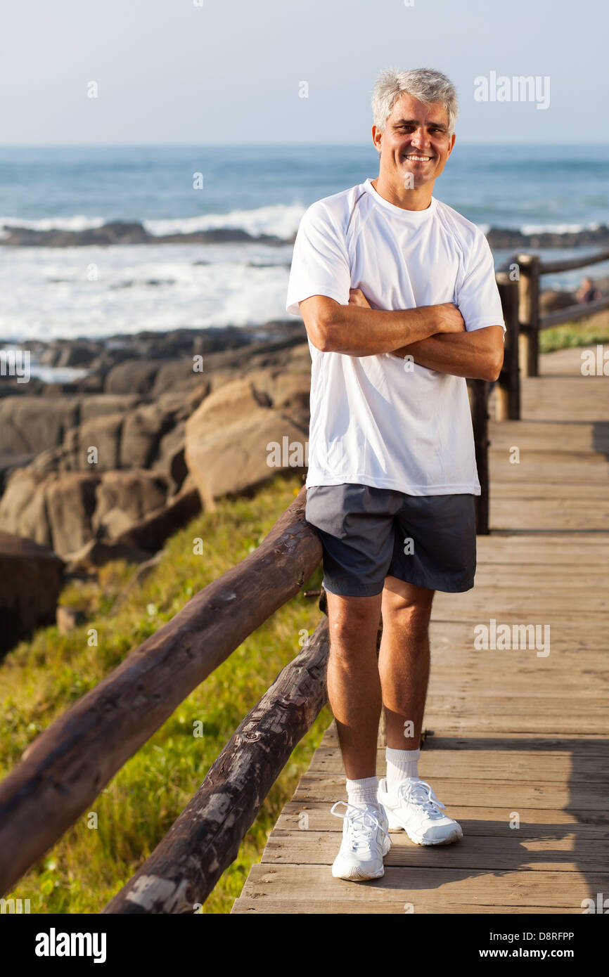sporty middle aged man portrait at the beach in the morning Stock Photo