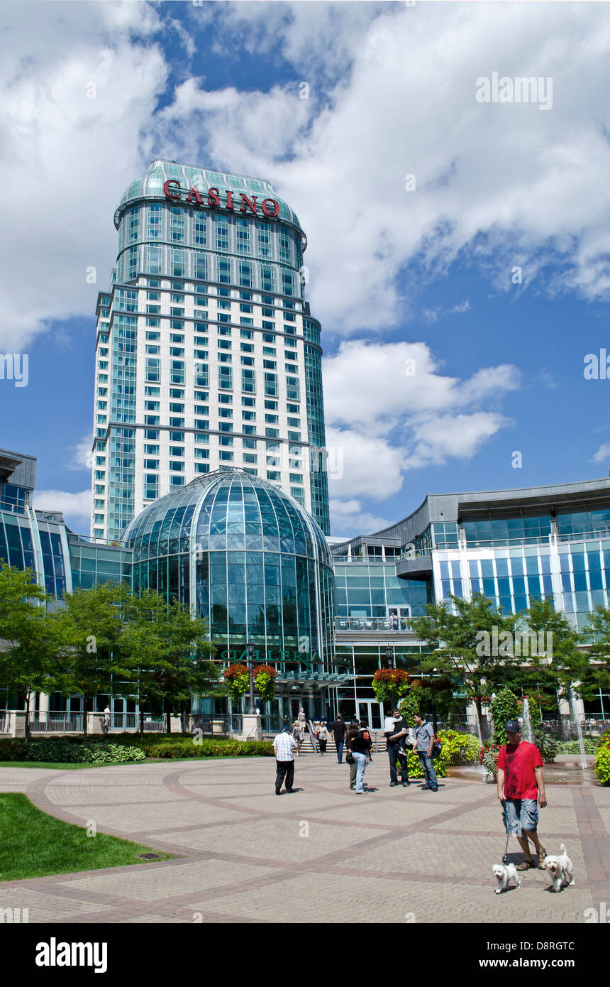 People walking in the plaza outside the Fallsview Casino Resort in Niagara Falls Canada. Stock Photo