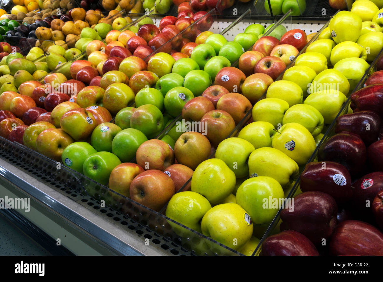 Apples in a display case at a family owned grocery store. Stock Photo