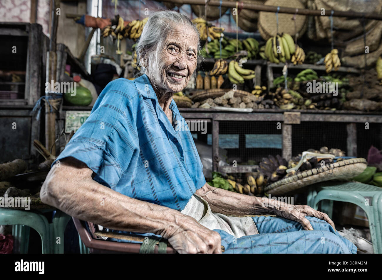 Old fruit seller waiting for clients, Romblon, Philippines, Asia Stock Photo