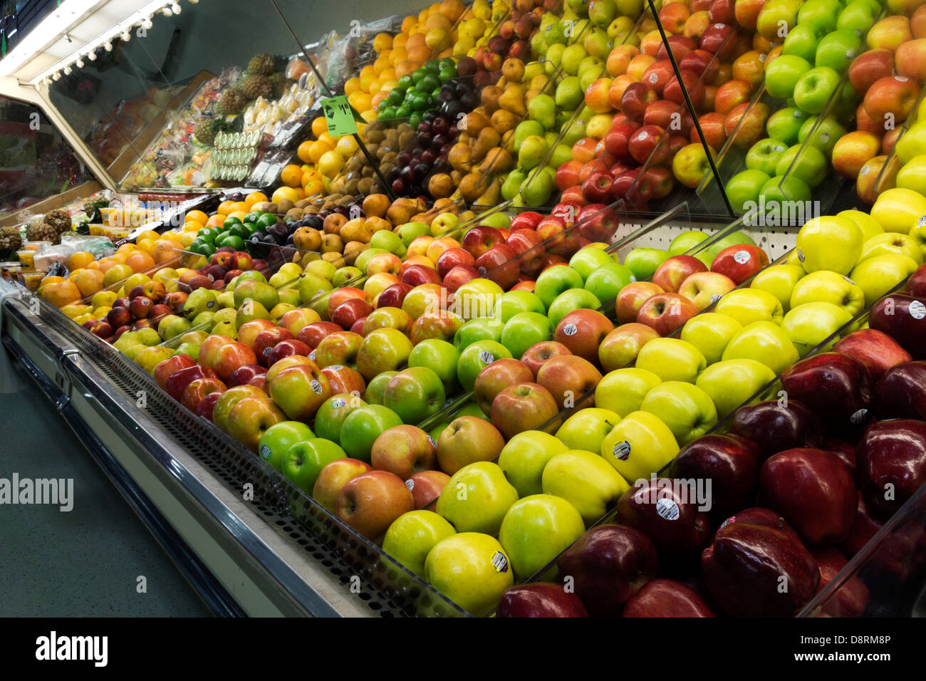 Apples in a display case at a family owned grocery store. Stock Photo