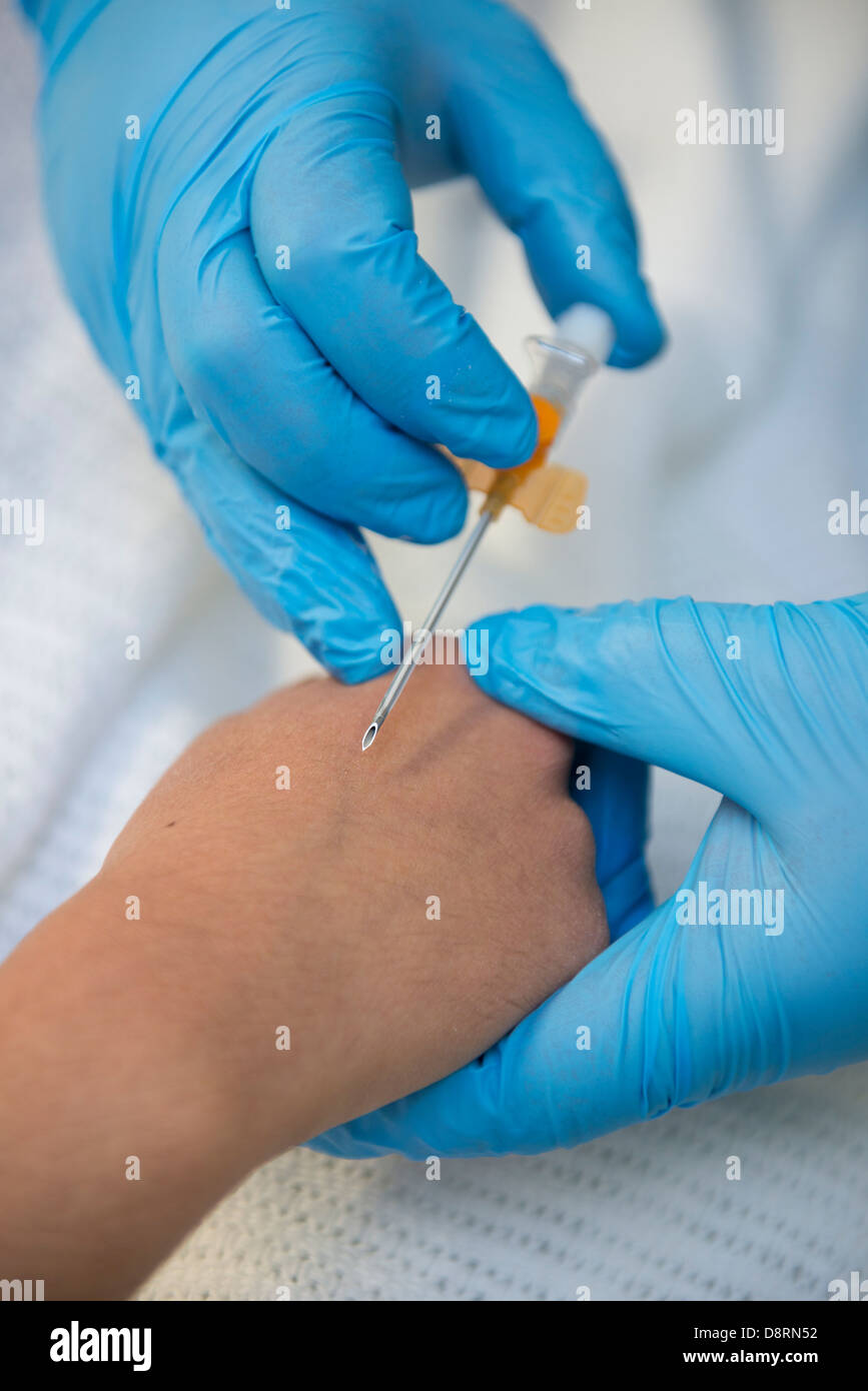 A cannula being prepared for insertion in a hospital. Stock Photo