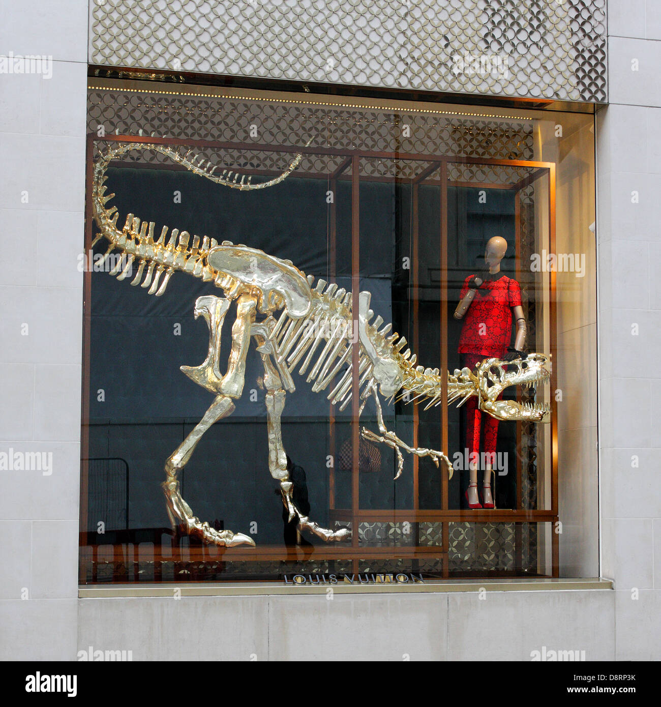 louis vuitton's gilded dinosaur skeleton window installation