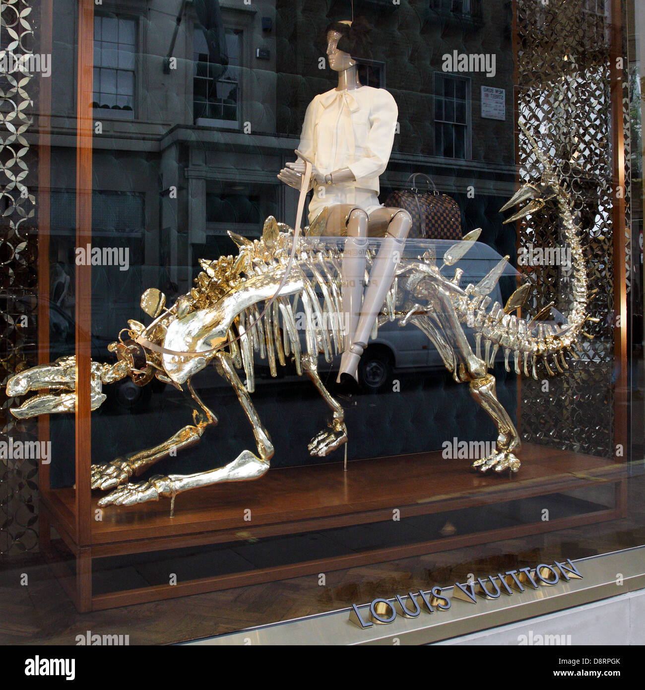 Dinosaur themed window display at Louis Vuitton`s flagship store in New  Bond Street,London Stock Photo - Alamy