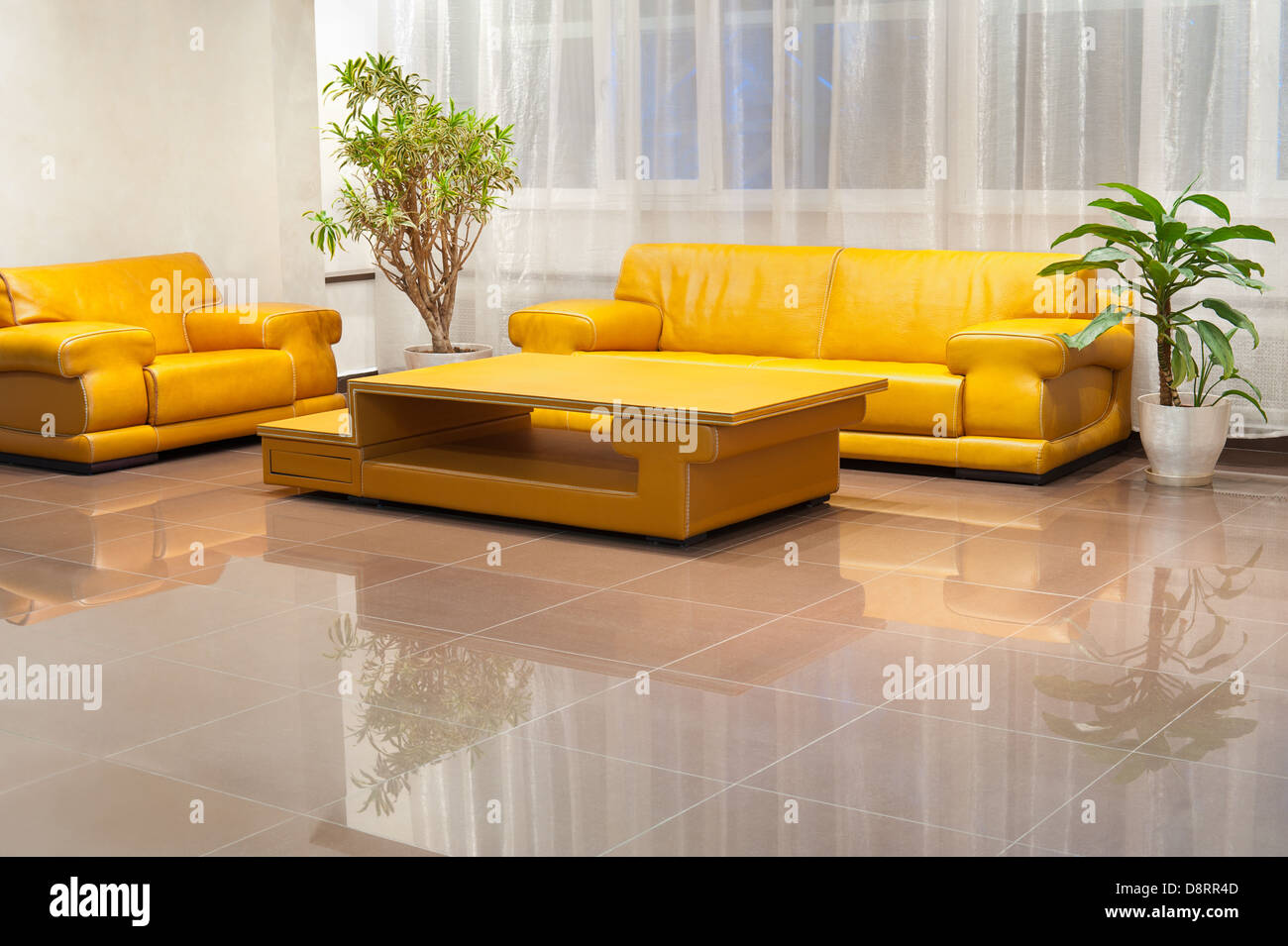 hall interior with yellow leather furniture Stock Photo Alamy