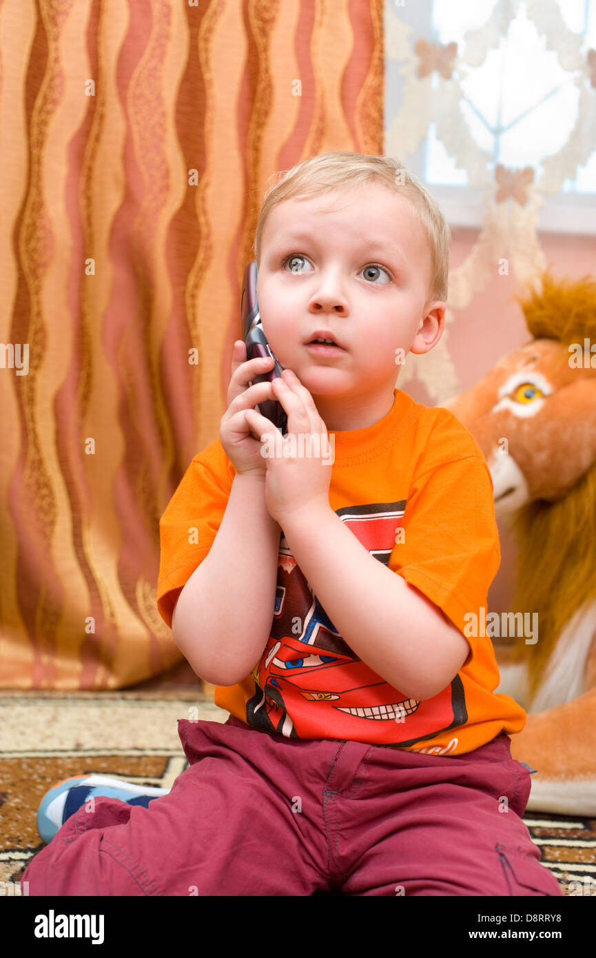 little kid speaks over cell phone Stock Photo Alamy