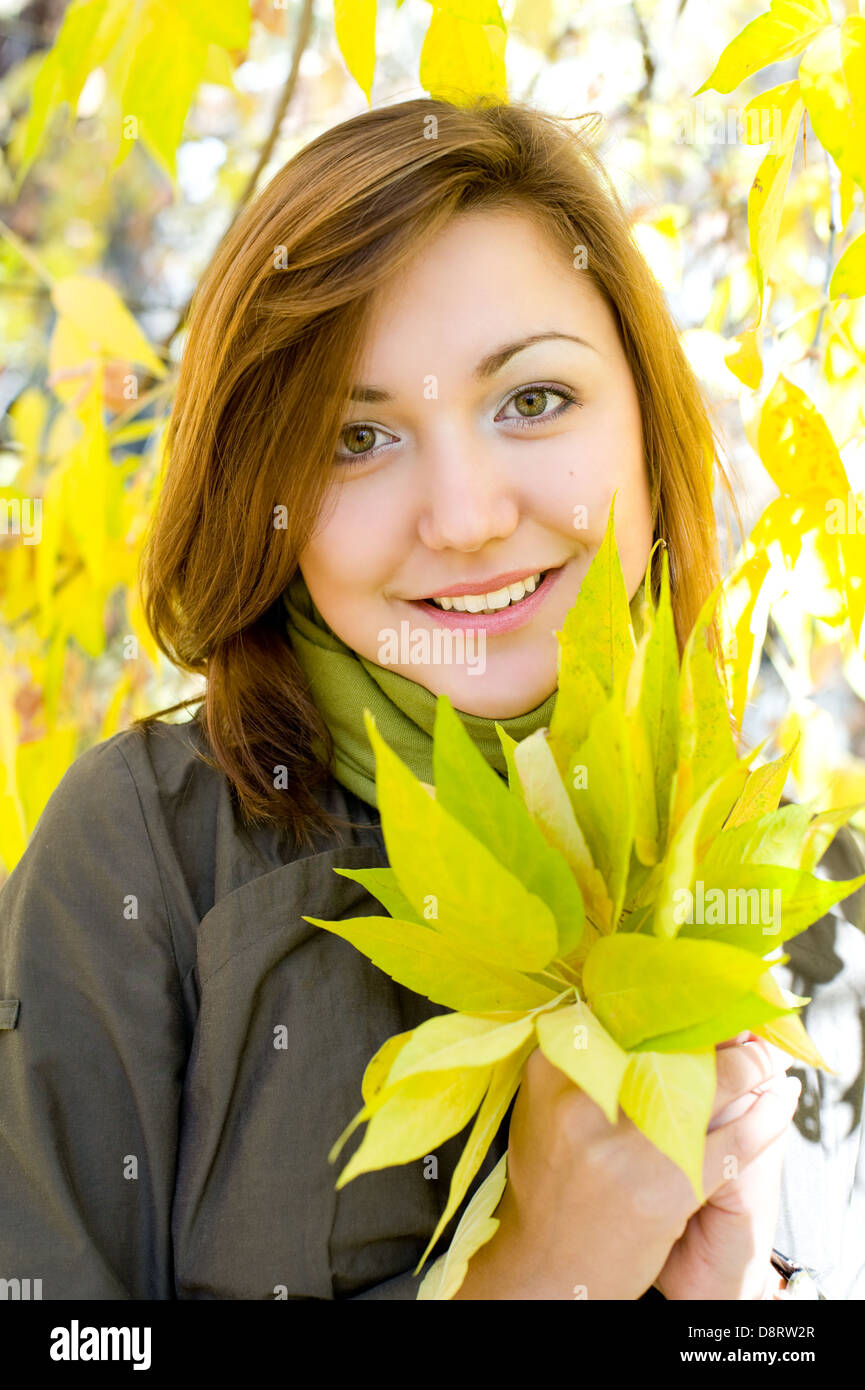 beautiful girl with autumn leaves Stock Photo - Alamy