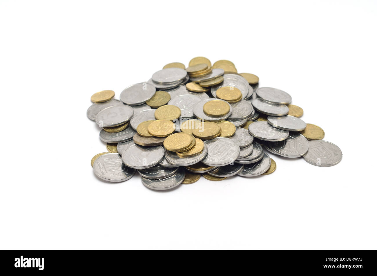 a large pile of coins on white background Stock Photo - Alamy