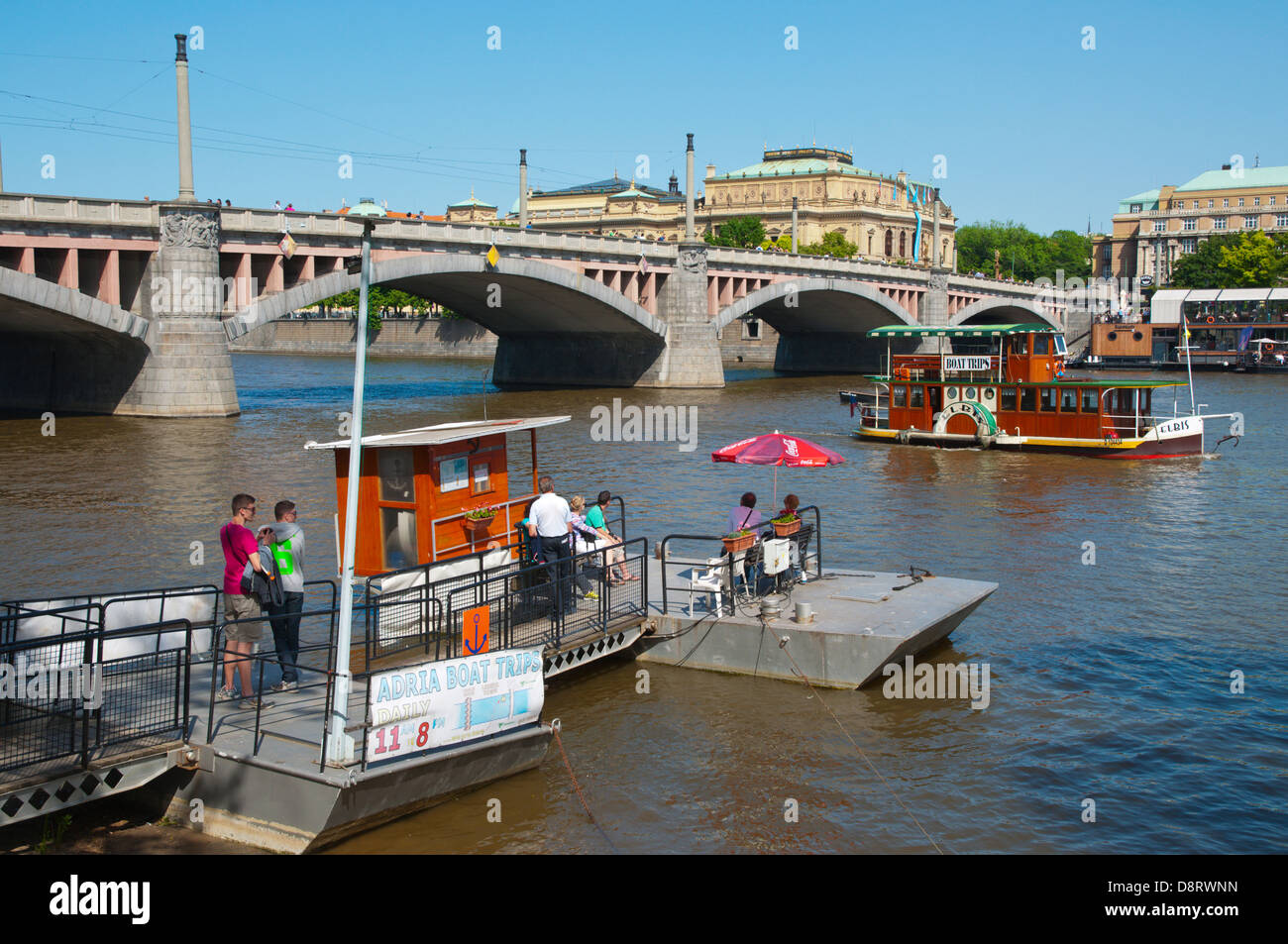 People waiting for a boat trip on pier Mala Strana district Prague city Czech Republic Europe Stock Photo