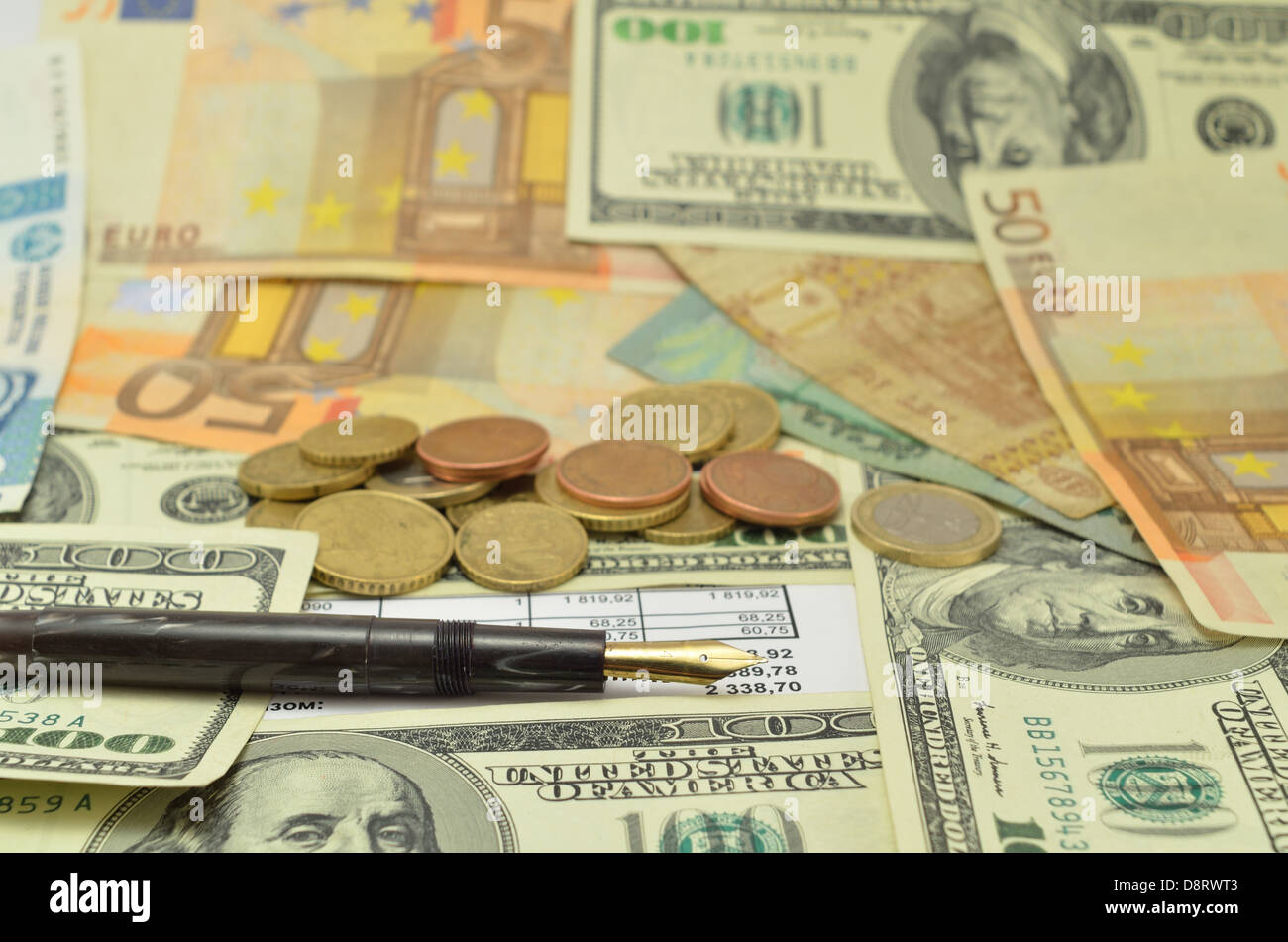 gray pen on the banknotes with coins and documents Stock Photo - Alamy