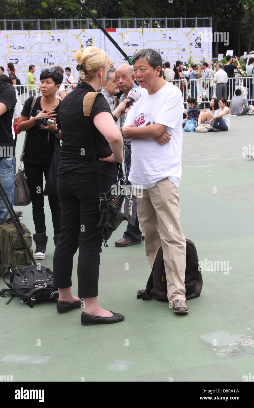 Hong Kong. 4th June 2013. One of the organisers of the annual June 4 Tiananmen Square Massacre Memorial protest in Hong Kong, Lee Cheuk-yan, speaks to a reporter. Credit:  Robert SC Kemp/Alamy Live News Stock Photo