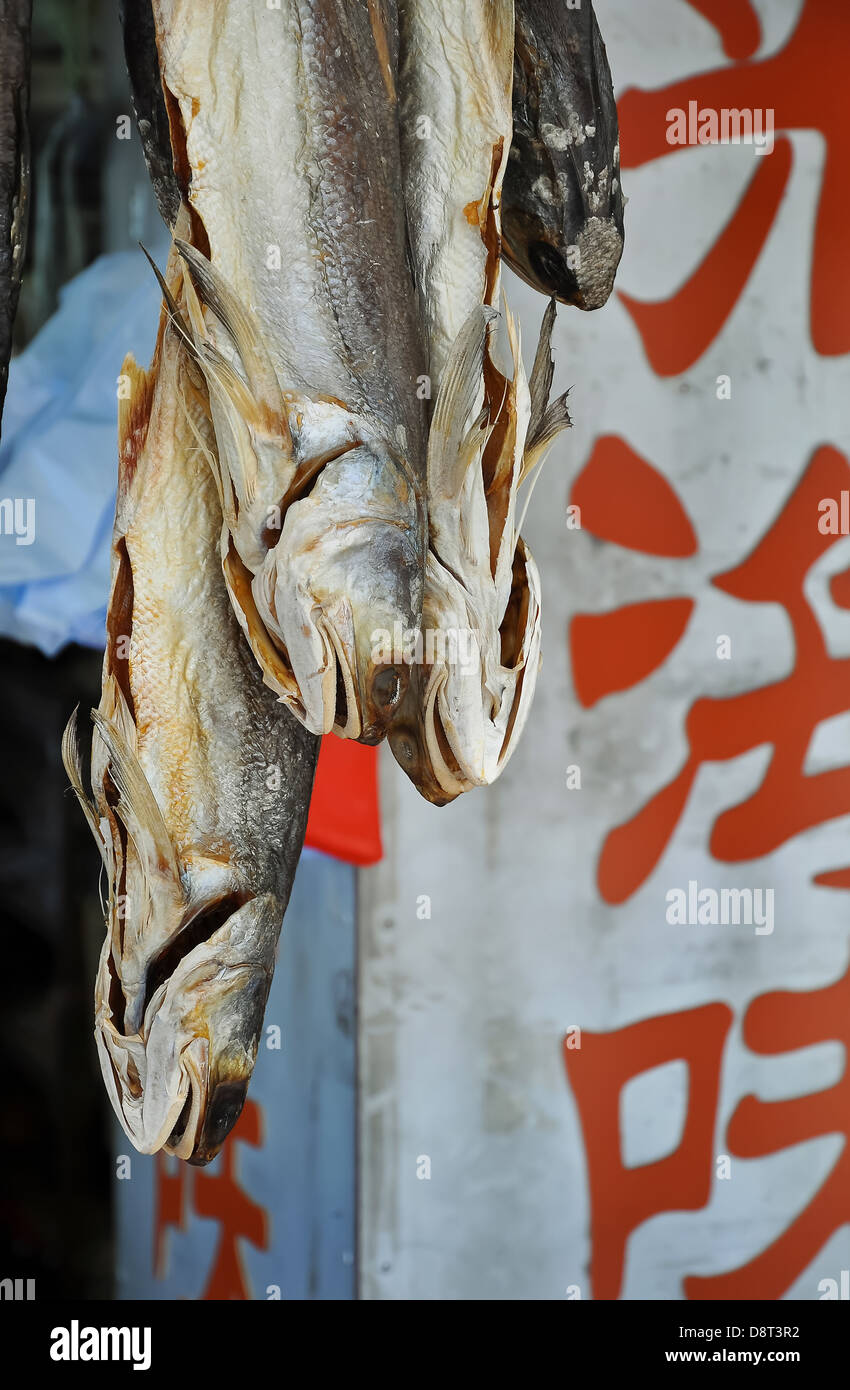 Salted fish hanging outside a shop on Cheung Chau, Hong Kong. Stock Photo